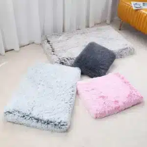 a group of fluffy pillows on the floor