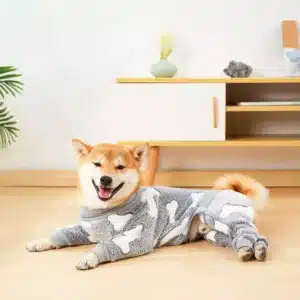 a dog wearing a gray pajamas