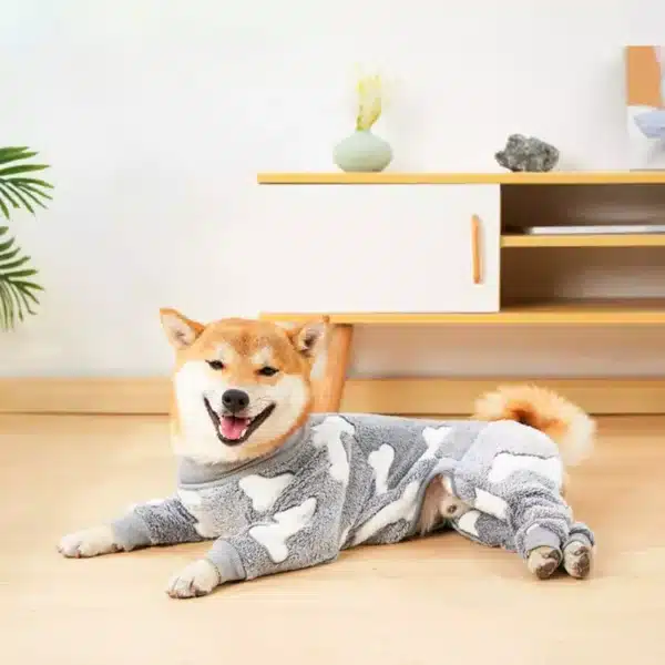 a dog wearing a gray pajamas